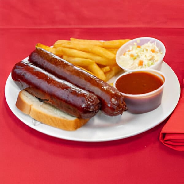 Two Terrell's Eat The Bone BBQ sausages on white bread with fries, coleslaw, and BBQ sauce.